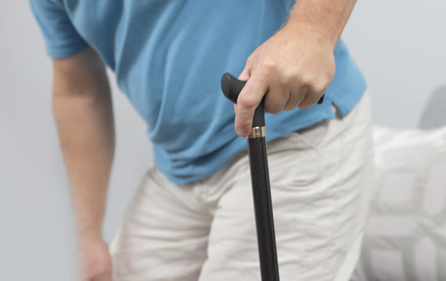 Senior holding cane