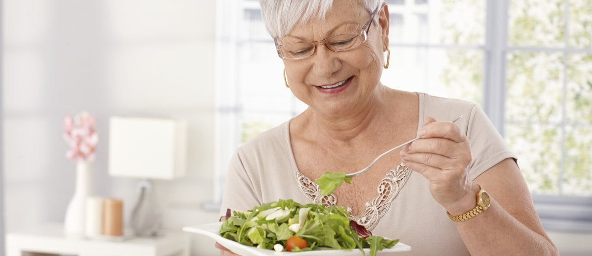 Senior woman eating healthy food
