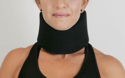Middle age woman wearing black neck brace