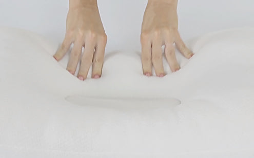hands on white pillow