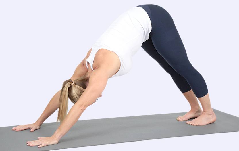 Woman performing a pose on a yoga mat