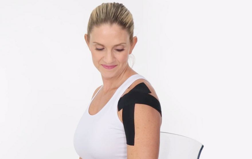 woman shoulder kinesio tape