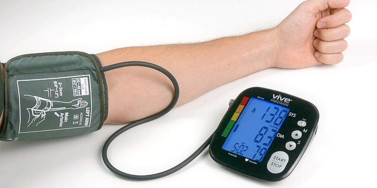 taking blood pressure with upper arm cuff