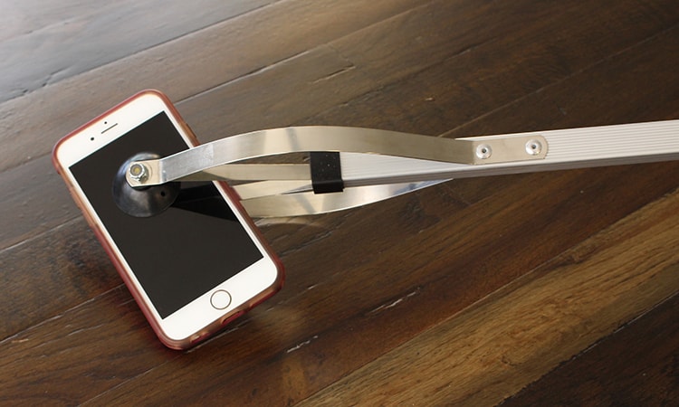suction cup grabber picking iphone