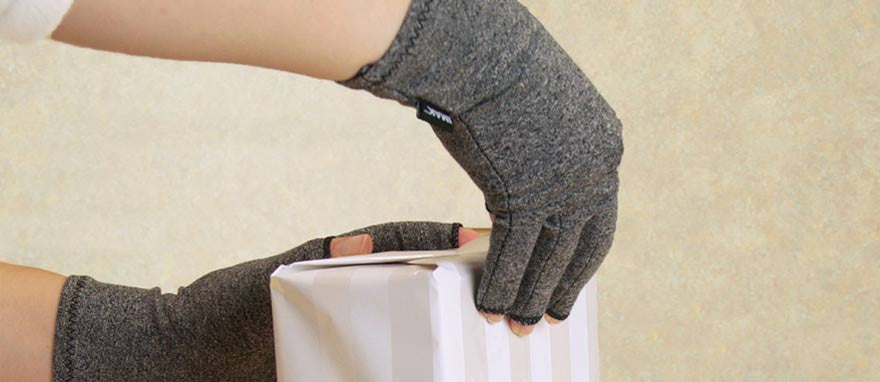 wearing compression arthritis gloves while gift wrapping