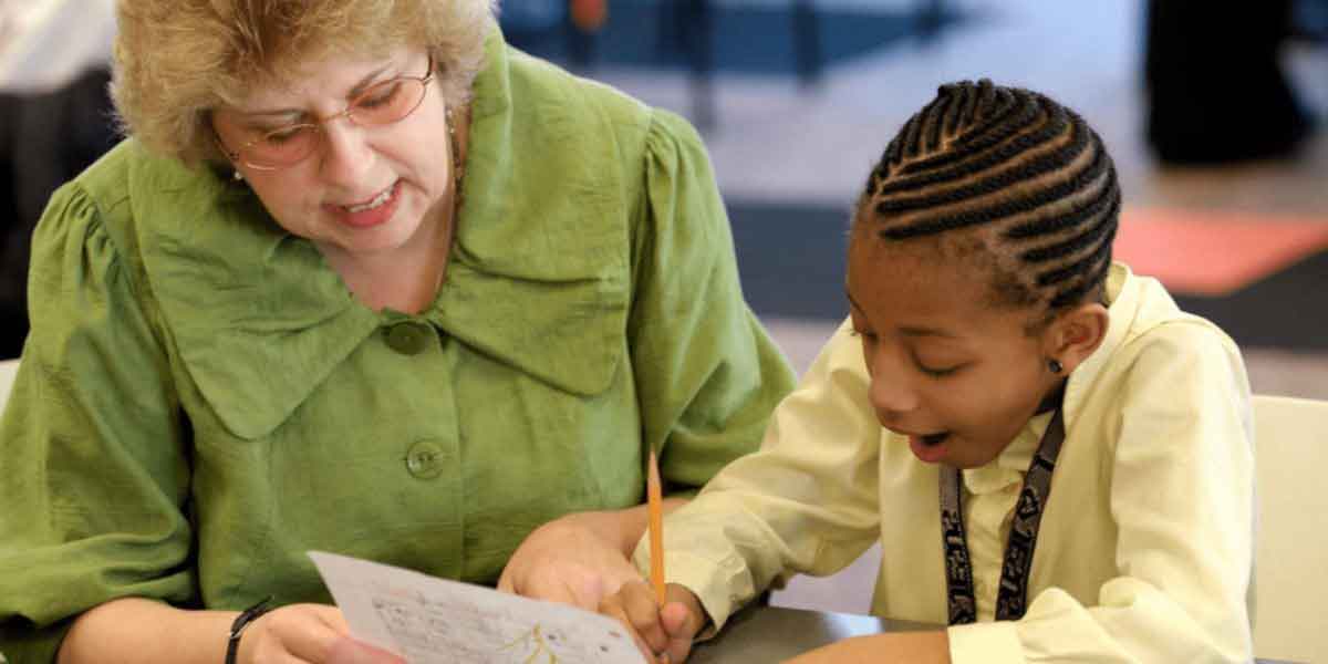 elder woman tutoring student