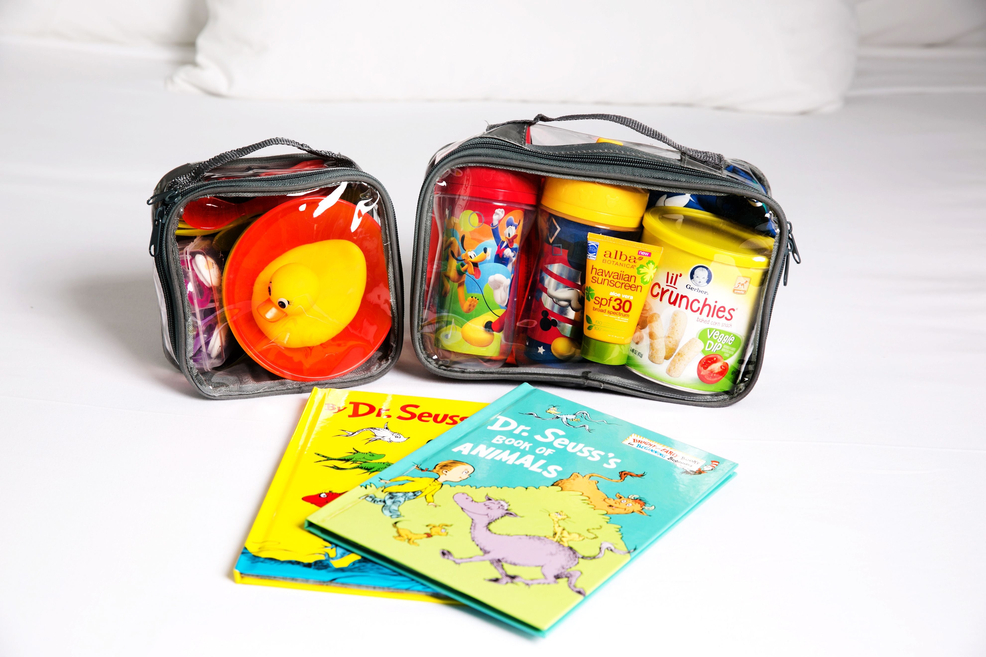 Kid's story books and essentials in packing cubes