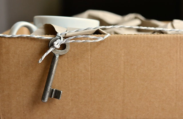 Moving cardboard box for college with key