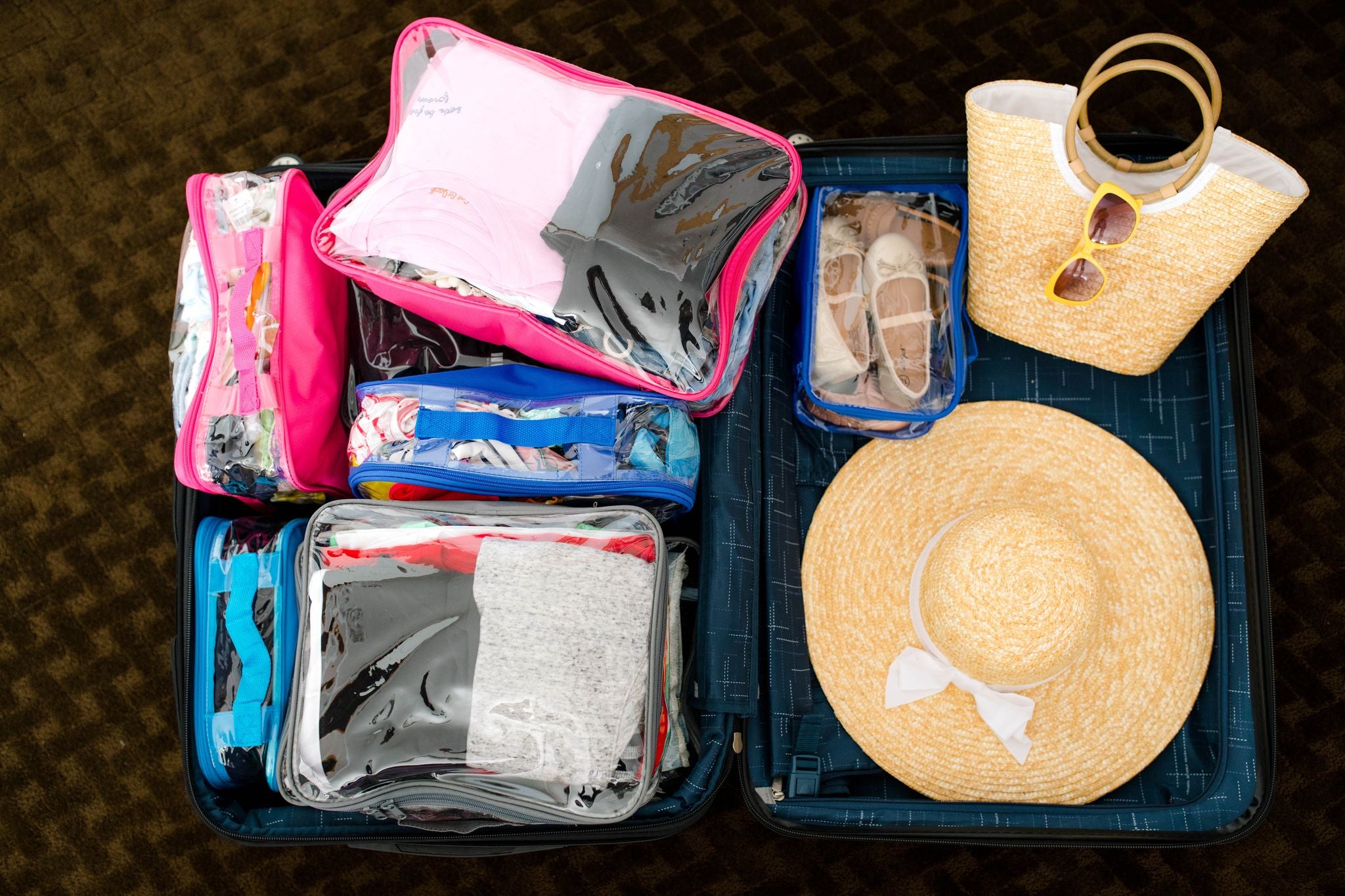 Suitcase organized with clear packing cubes