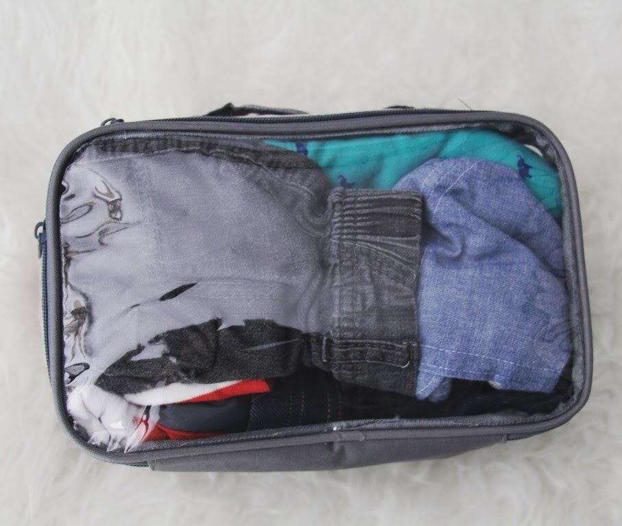 Small packing cube with baby’s travel clothes