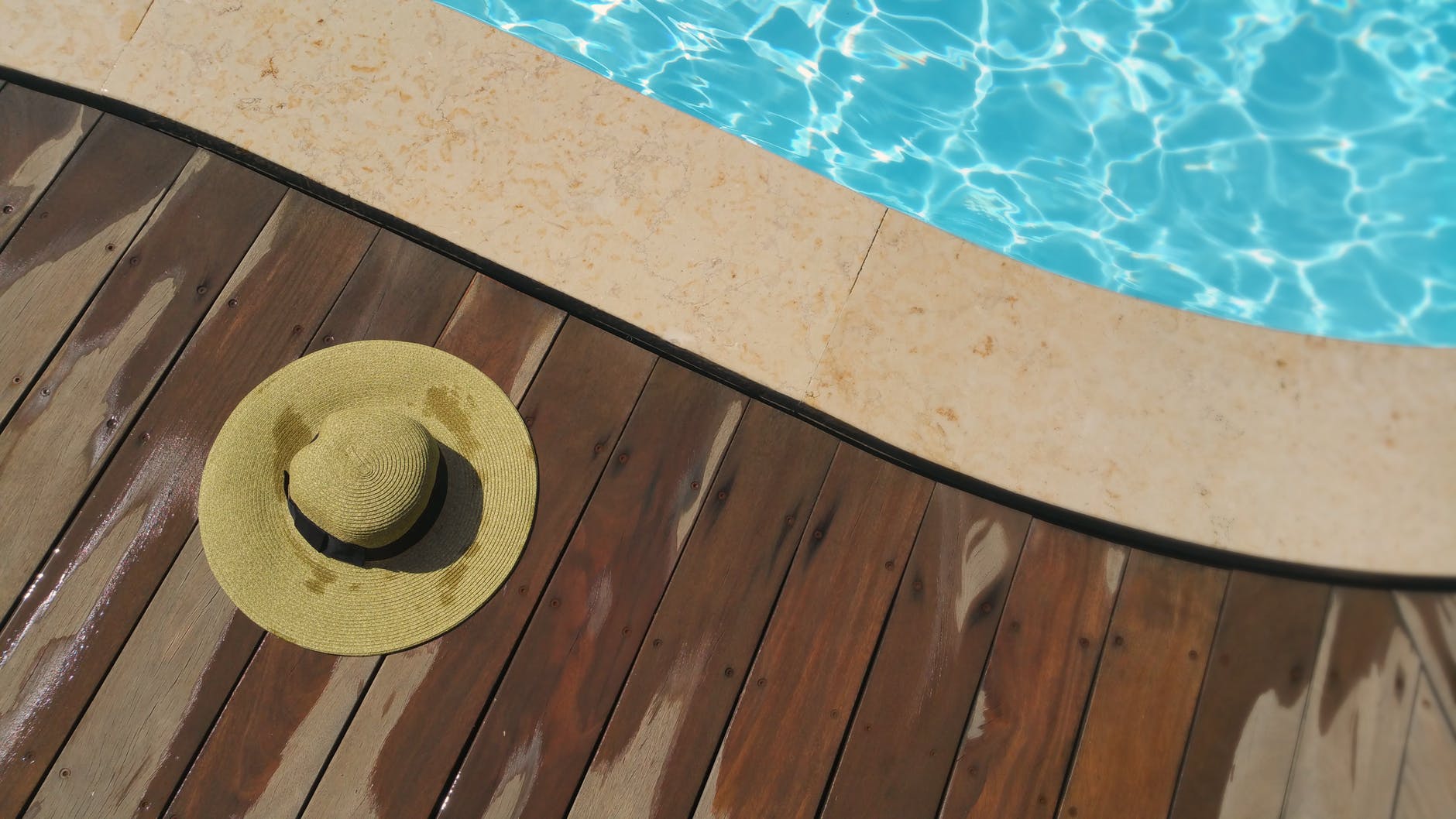Straw hat by cruise poolside