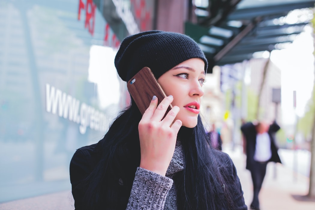 Woman calling family while traveling