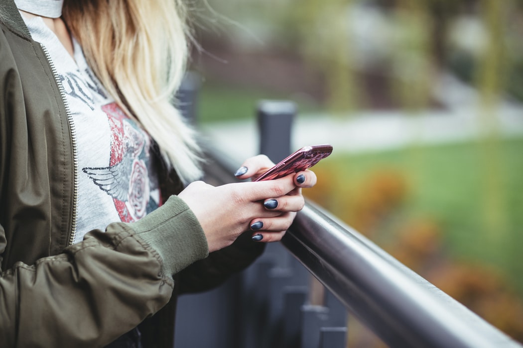 Woman using smartphone while on vacation