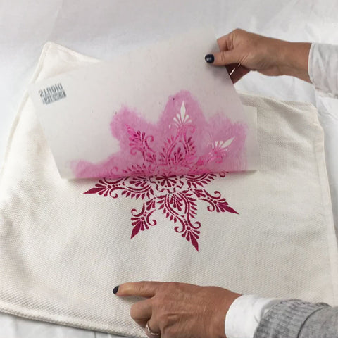 peeling the stencil from the cushion cover. The Stencil Studio Indian Star stencil