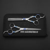 hair cutting shears and blending scissor lying on black leather pouch