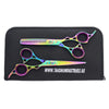 cutting scissor and hair thinning scissor lying on leather pouch in white background