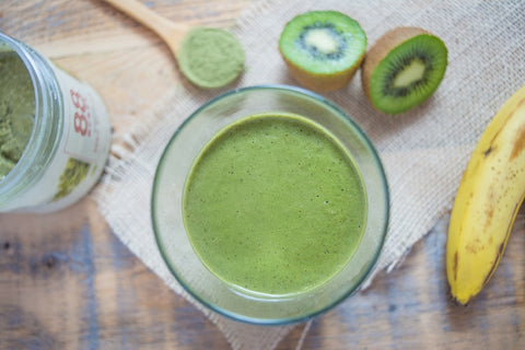 Green smoothie with sliced kiwi, banana, and pumpkin seed butter. Quick, easy recipe for a healthy snack. 