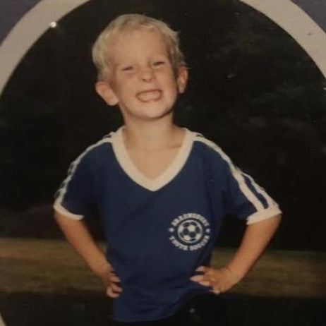 Rob as a kid, wearing his soccer uniform
