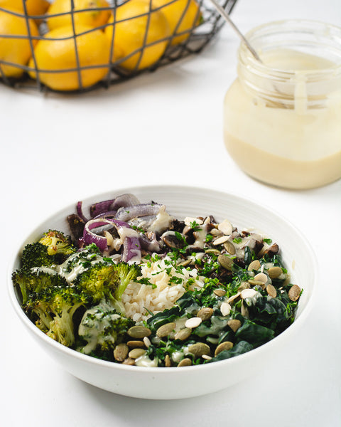 Healthy grain bowl with kale, roasted veggies, and caramelized mushrooms. Super easy and quick to prepare!