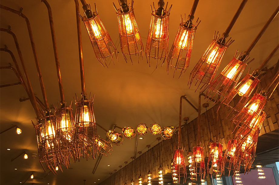 Nando's Hove has Bright Goods LED filament lamps in quirky metal cage light fittings