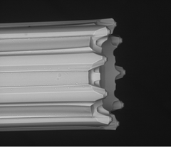 SEM high resolution image of the multi-nozzle emitter with nine independent channels. Each channel is 10 micrometers, which is approximately 1/10th the diameter of the average human hair.