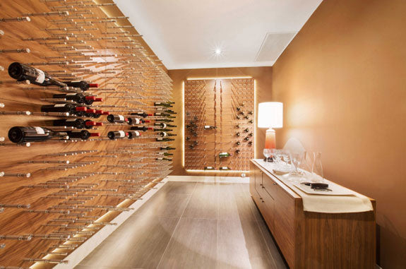wine collector are displaying their wine collection on a wine pegs system.