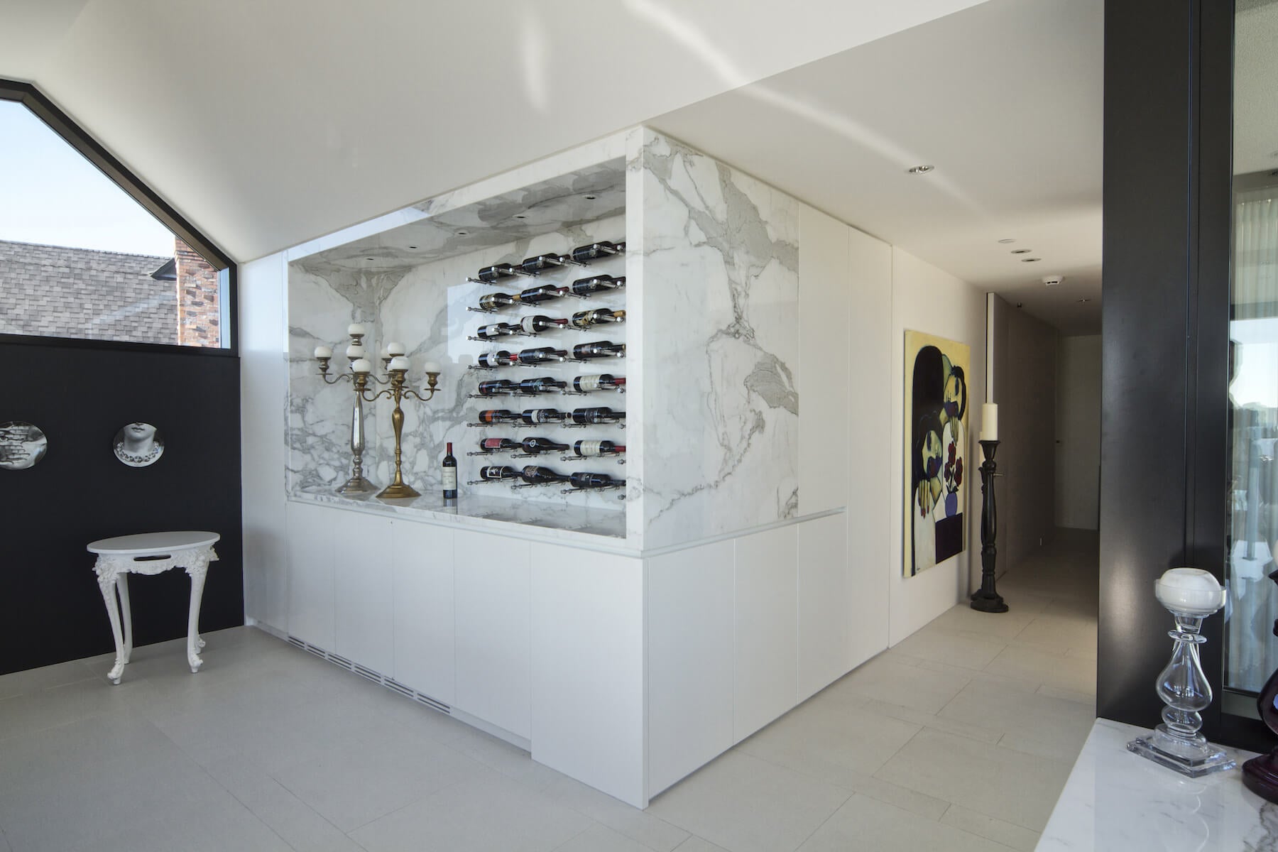 Wine peg rack system on a marble wall