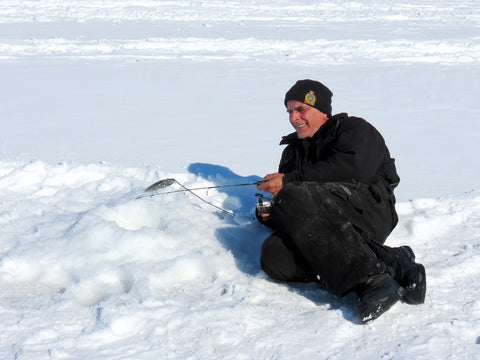Laying on Ice while fishing