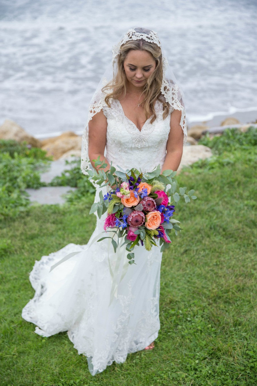 new zealand wedding bride in mantilla veil and pink bouquet