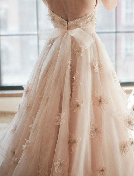 Blush wedding dress with flowers