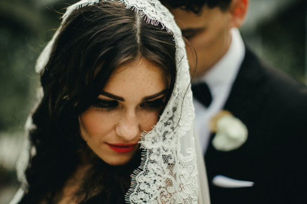 bride in spanish mantilla wedding veil french alencon lace