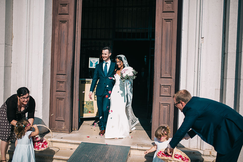 bride and groom leaving cathedral after wedding