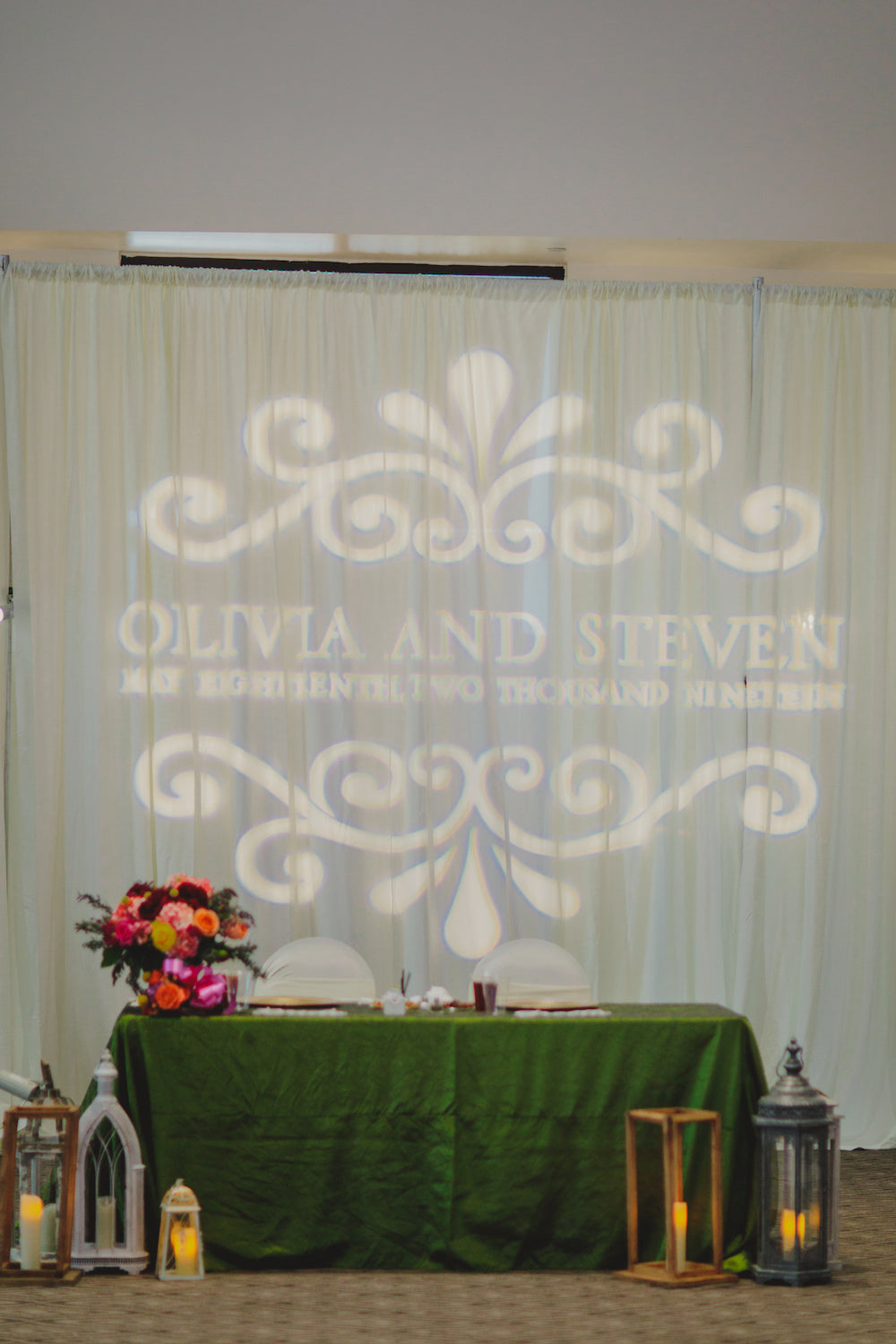 green bride and groom couples table