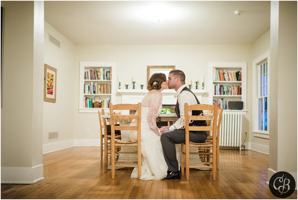 at home wedding bride and groom at table