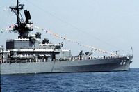 Crewmembers man the rails at the stern of the guided missile cruiser USS BELKNAP (CG 26) as the ship lies at anchor in a Mediterranean port. -1990