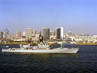 As it passes along the city shoreline the crew mans the rails of the US Navy (USN) Belknap Class of guided missile cruiser USS HORNE (CG 30) as they participate in a ship parade, a tribute by San Diego to the US Navy and attended by the public on shore and civilian boats.  -1990