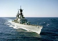 A starboard bow view of the guided missile cruiser USS BELKNAP (CG-26) underway during exercise Distant Drum. - 1983