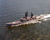 An aerial port bow view of the guided missile cruiser USS BELKNAP (CG 26) underway. - 1981