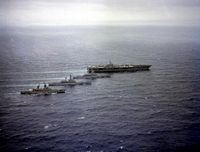 Aerial starboard view of (left to right) the guided missile cruiser USS BIDDLE (CG 34), the nuclear-powered guided missile cruiser USS TEXAS (CGN 39), the nuclear-powered aircraft carrier USS MISSISSIPPI (CGN 40) and the nuclear-powered aircraft carrier USS NIMITZ (CVN 68) underway. - 1981