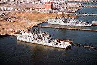 An aerial view of the Baltimore Fairfield Terminal area showing various former U.S. Navy destroyers awaiting the scrapper's torch. From bottom to top: the destroyers BLANDY (DD-943) and FOREST SHERMAN (DD-931), the former U.S. Army N-3 type port repair ship<br>November 1994