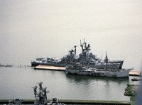 An aerial view of part of Baltimore Fairfield Marine Terminal showing the destroyers BLANDY (DD-943) and FORREST SHERMAN (DD-931) tied up on the far side of the pier awaiting scrapping.<br>August 1994