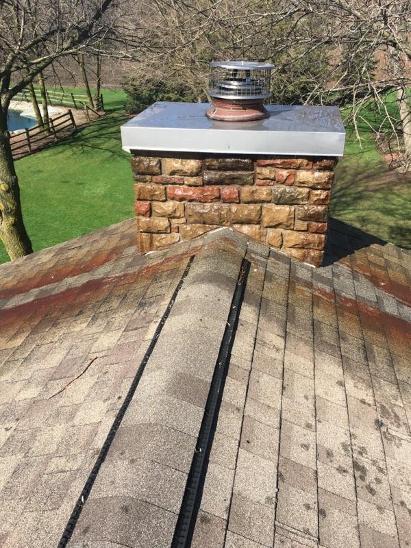 Rust Removed from Stone Chimney