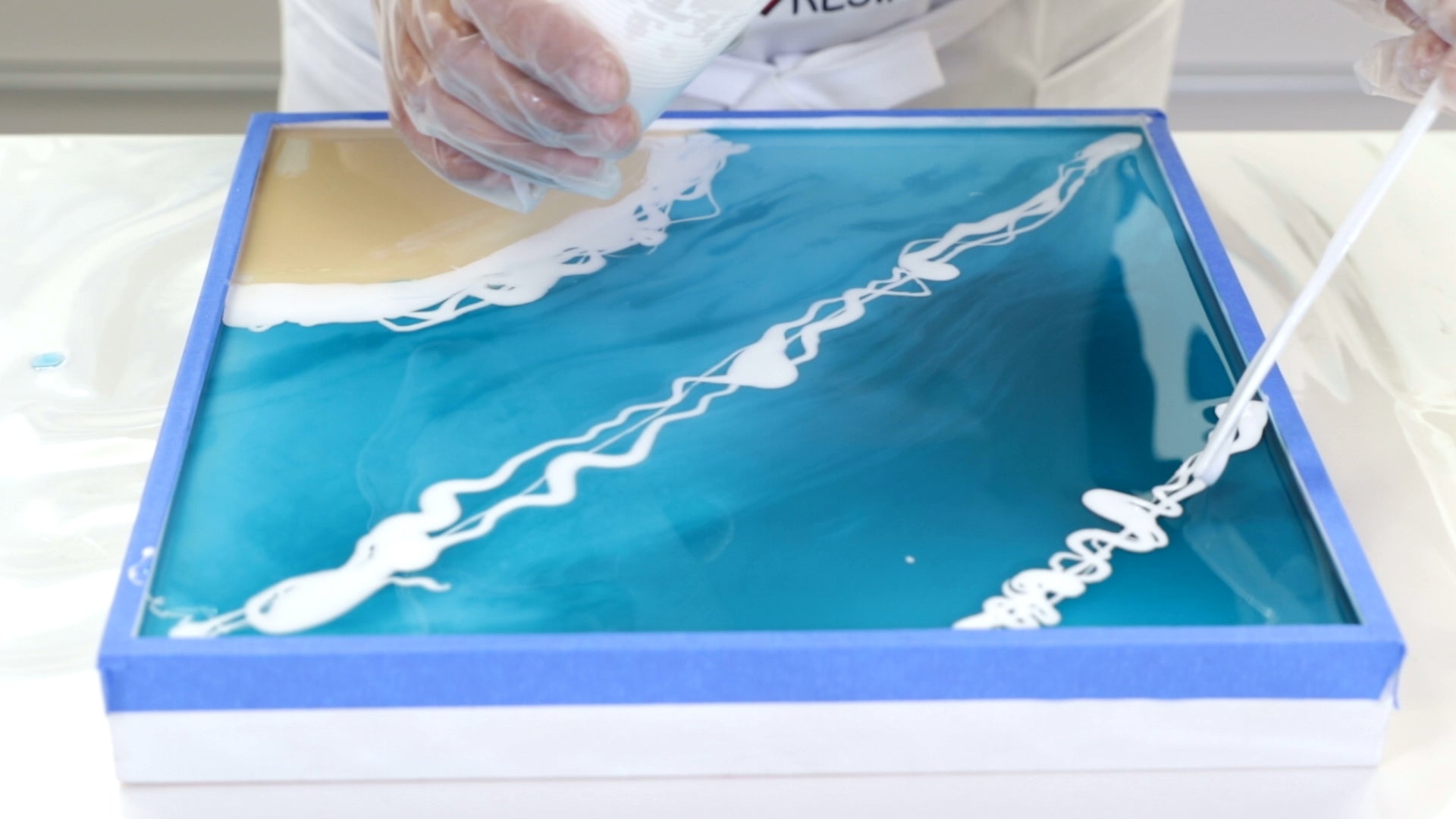 Make Ocean Resin Art - Add a second line of white as you wish