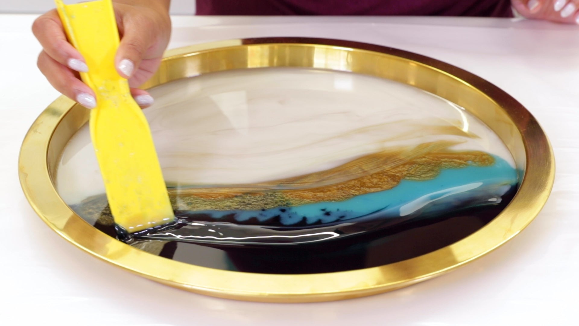 Create Resin Flow Art - Gently run a spatula through the resin to create a pattern