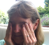 woman rubbing her eyes because they feel dry and irritated