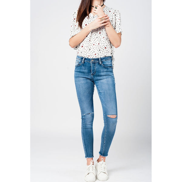 Skinny jeans in midwash with busted knees and chewed hems Skinny jeans in midwash with busted knees and chewed hems