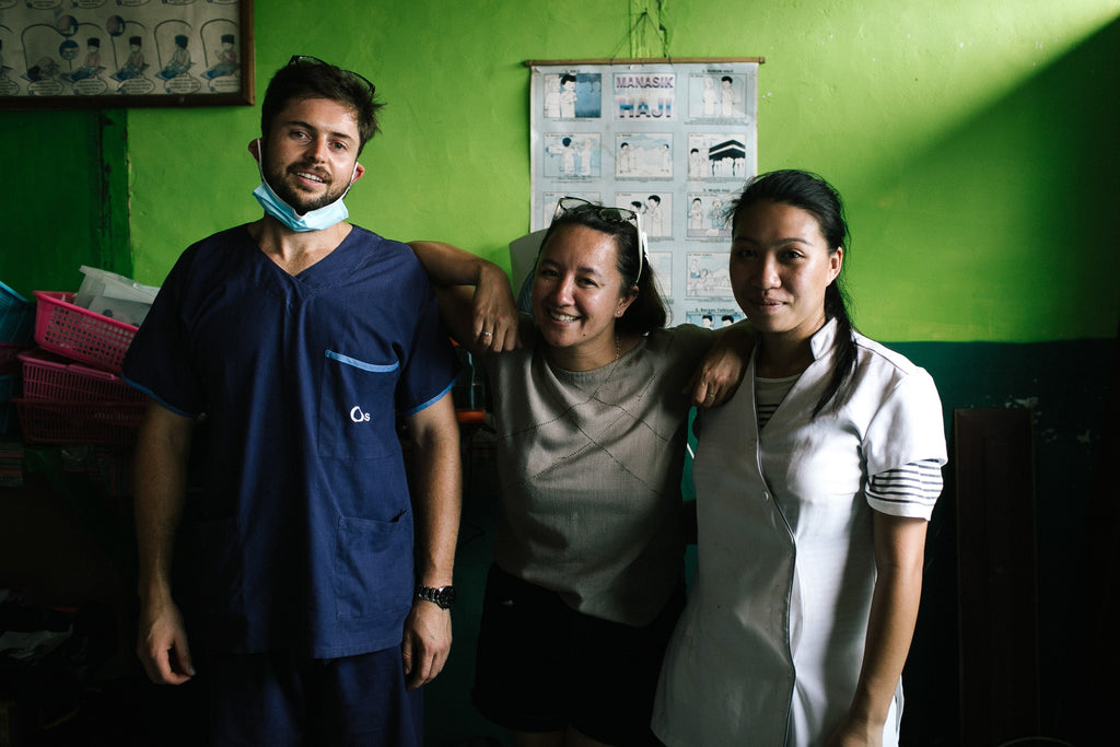 Yanti Turang with two physicians 