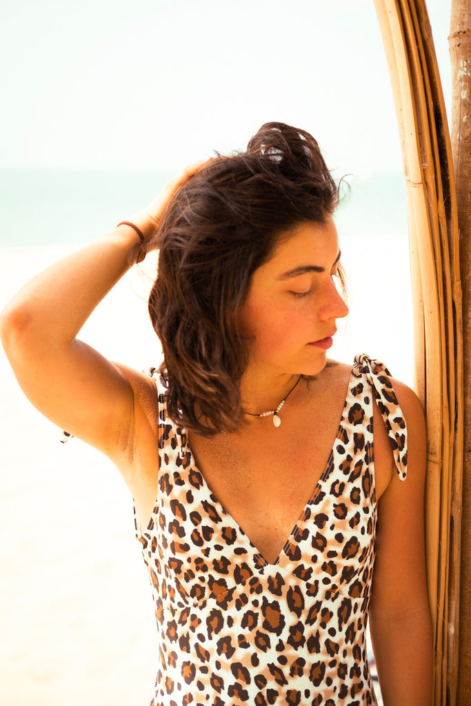 girl wearing cowrie shell necklace in thailand