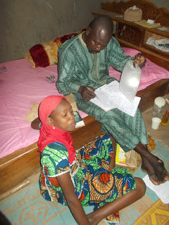 Family using light to do school work at night.