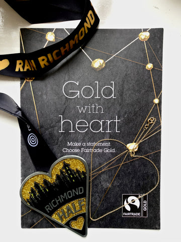 My half marathon medal, Fairtrade brochure and Fairtrade gold chain from Curteis